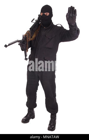 mercenary in black uniforms with machine gun Stock Photo