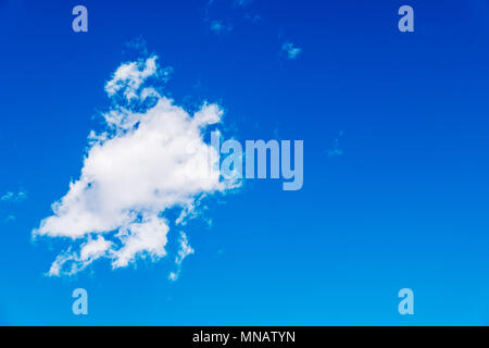 Puffy white clouds against a clear azure blue Colorado sky. Stock Photo