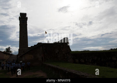 Galle Fort Clock Tower at Galle in Sri Lanka. The tower is silhouette against the sky. Stock Photo