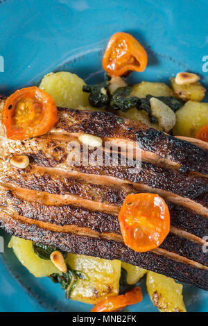 Fresh Grilled Salmon with Vegetables on Blue Plate. Healthy Meal Concept. Stock Photo