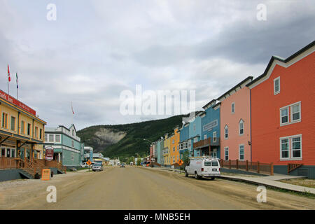 DAWSON CITY, YUKON, CANADA, JUNE 24 2014: Historic buildings and typical traditional wooden houses in a main street in Dawson Citiy on June 24, 2014, Yukon Territory. Stock Photo