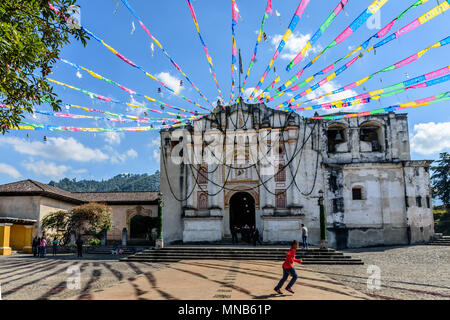 San Juan del Obispo, Guatemala - December 27, 2015: Locals outside one of oldest Catholic churches in Guatemala in small village Stock Photo