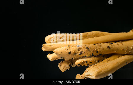 homemade snack, baked sticks with sesame and black cumin. Cristy sticks with sesaam and cumin seeds Stock Photo