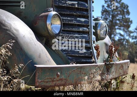 rusty old truck in field Stock Photo