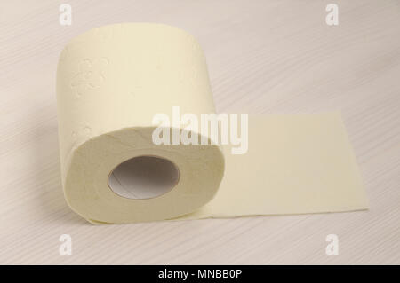 Toilet paper roll on a wooden hanger Stock Photo - Alamy