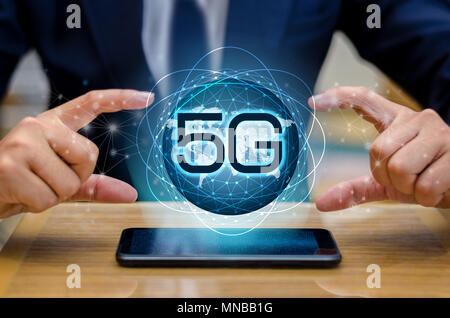 phone 5g Earth businessman connect worldwide waiter hand holding an empty digital tablet with smart and 5G network connection concept Stock Photo