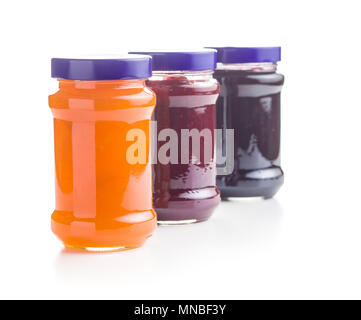 Tasty fruity jam in jar isolated on white background. Stock Photo