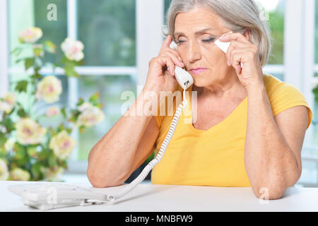 Portrait of upset senior woman Stock Photo