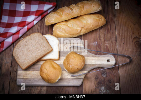 An overview of of various breads on a cutting board. Stock Photo