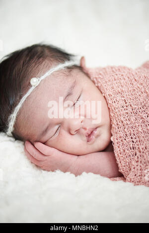 One newborn baby girl sleep on soft pillow Stock Photo