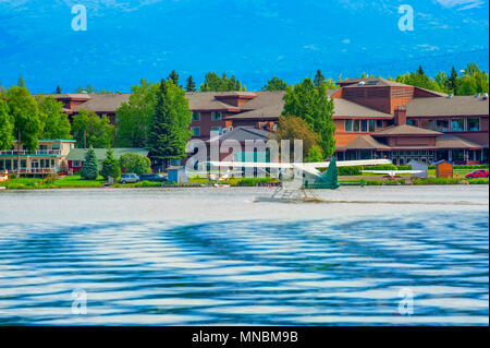 A seaplane taxies to the end of Lake Hood in Anchorage, Alaska, where it will then take off using the length of the lake. Stock Photo