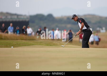 MUIRFIELD, SCOTLAND - JULY 18: Hideki Matsuyama birdie putt at the 5th green during the first round of The Open Championship 2013 at Muirfield Golf Club on July 18, 2013 in Scotland. Stock Photo