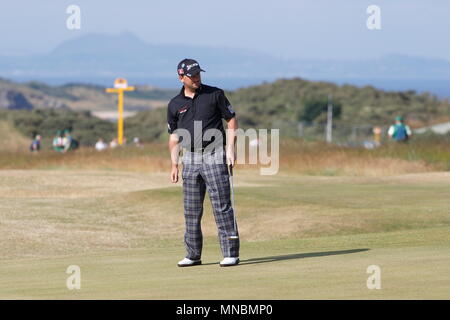 MUIRFIELD, SCOTLAND - JULY 16: Graeme MCDOWELL putt son the 11th green during a practice round of The Open Championship 2013 at Muirfield Golf Club on July 16, 2013 in Scotland. Stock Photo