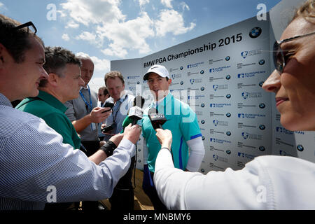 Rory McIlroy gives media interviews after finishing at -1 under for the day  during the first round of the BMW PGA Championship tour at Wentworth Golf Club. 21 May 2015 --- Image by © Paul Cunningham Stock Photo