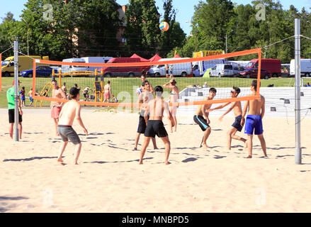 Vasteras, Sweden - July 3, 2015: Spontaneous youngsters play beach volleyball at Logarangen beach. Stock Photo
