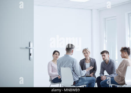 People participating in group therapy for PTSD Stock Photo