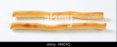 two crispy bread sticks on white background Stock Photo