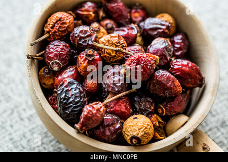Dried Rosehips in wooden ladle / kusburnu. Organic Concept. Stock Photo