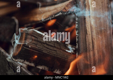 flame on burning wood in fireplace Stock Photo