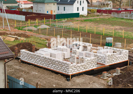 cement-filled Foundation of a private house, the Foundation of the house under construction, fresh concrete Foundation Stock Photo