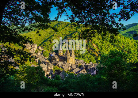 Elevated view of Conques village and abbey-church of Sainte-Foy the jewel of Romanesque art, Occitanie, France. Stock Photo