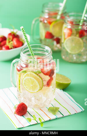refreshing summer lemonade with strawberry and lime in mason jar Stock Photo