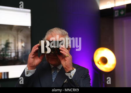 The Prince of Wales looks through a virtual viewer during a visit the YouTube Space London in Kings Cross as part of a whirlwind tour of innovative businesses in the capital. Stock Photo