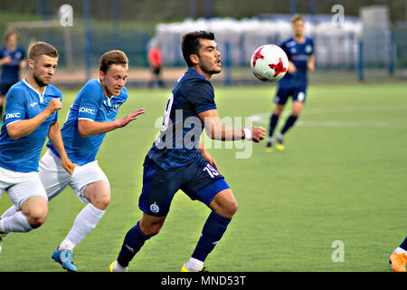 MINSK, BELARUS - MAY 14, 2018: Soccer player NOYOK ALEKSANDR fights for ball during the Belarusian Premier League football match between FC Dynamo Minsk and FC Luch at the Olimpiyskiy stadium. Stock Photo