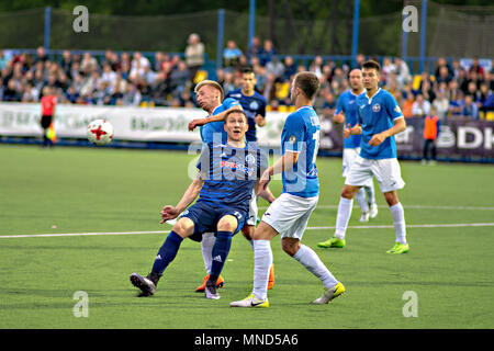 MINSK, BELARUS - MAY 14, 2018: Soccer players fights for ball during the Belarusian Premier League football match between FC Dynamo Minsk and FC Luch at the Olimpiyskiy stadium. Stock Photo