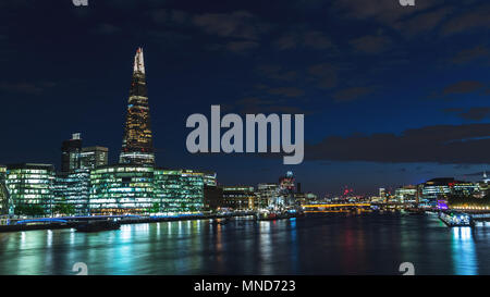 Panoramic view of modern London skyline at night on River Thames Stock Photo