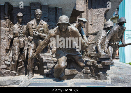 Detail of Polish resistance fighters portrayed in the Monument To The Warsaw Rising in Plac Krasinskich in the center of Warsaw, Poland. Stock Photo