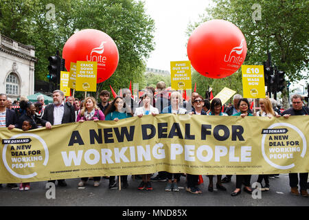 General Secretary of the Trades Union Congress (TUC) Frances O'Grady (centre, in white), holds a banner alongside march-goers as demonstrators calling for fairer pay and rights for workers, as well as against public service cuts and workplace discrimination, gather on Victoria Embankment ahead of the TUC-organised 'New Deal for Working People' march. Behind them fly balloons of the Unite trade union. Stock Photo