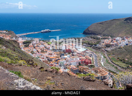 Looking down on the town harbour and ferry port of San Sebastian on the island of La Gomera in the Canary Islands Stock Photo