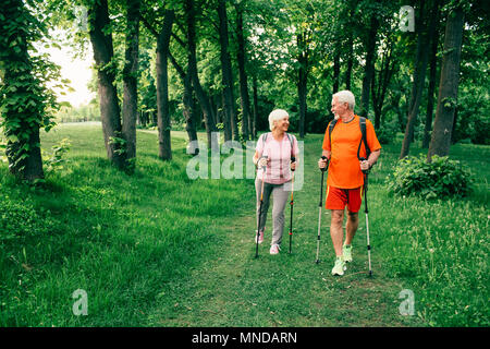 Senior couple walking forest together Stock Photo