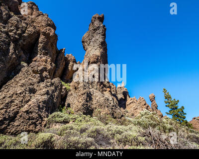 Eroded brecciated lava pinnacles at the edge of the Las Canadas caldera of Mount Teide near Boca Tauce Tenerife in the Canary Islands Stock Photo