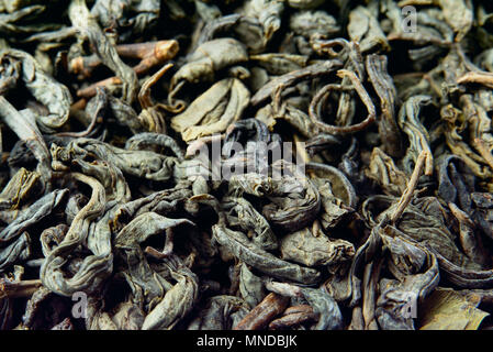 Dry leaves of green tea. Close-up. Stock Photo