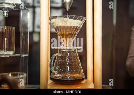 Close up Drip brewing, filtered coffee professional barista stuff. Modern Coffee culture concept. Selective focus. space for text Stock Photo
