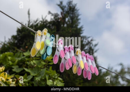 Clothes pegs on washing line Stock Photo