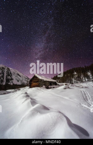 The mountains and refuge huts of Parc National Du Mercantour photographed at night. Stars shine bright in this amazing moonlight landscape. Stock Photo