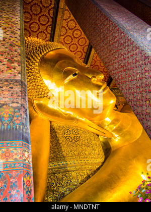 Detail of Reclining Buddha Statue, close-up of the face, Wat Pho Temple, Bangkok, Thailand Stock Photo