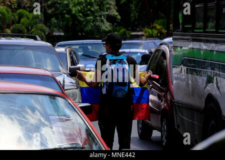 Valencia, Carabobo, Venezuela. 16th May, 2018. May 16, 2018. Students accompanied by civil society protested in the shantytown of Guaparo, against the presidential elections. They called not to vote in what they describe as an electoral fraud where they will not be elected because of the kidnapping of Venezuela's electoral system and would be endorsing an illegitimate government. In Valencia, Carabobo state. Photo: Juan Carlos Hernandez Credit: Juan Carlos Hernandez/ZUMA Wire/Alamy Live News Stock Photo