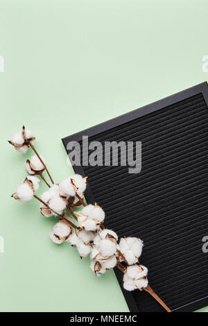 Black letterboard with space for text on green background. Blank letter board with copy space. Stock Photo