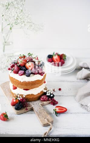 Midsummer Layer Cake with Whipped Cream and Berries Stock Photo