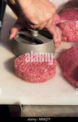Burger patties being formed Stock Photo