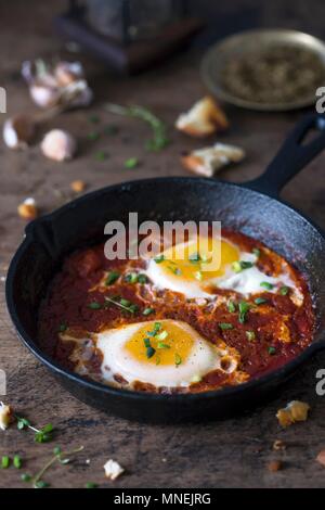 Shakshuka (poached eggs in tomato and pepper sauce, Middle East) Stock Photo