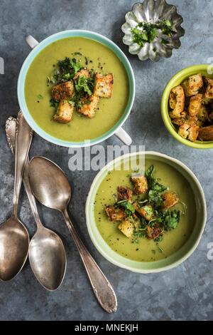 Vegan spinach, leek, courgette & coconut milk soup with spicy croutons Stock Photo