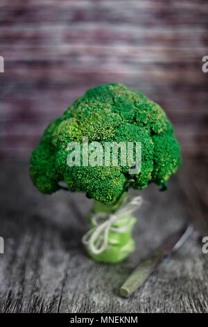 Broccoli on wooden surface Stock Photo