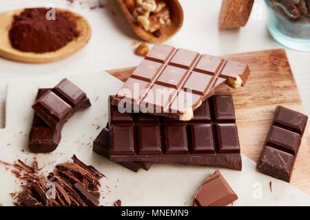 An arrangement of various chocolate bars and cocoa