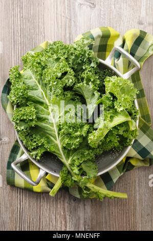 Fresh kale in a colander (seen from above) Stock Photo