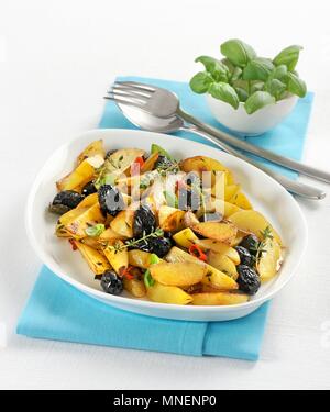 Olive fritte con patate (fried potatoes with olives, Italy) Stock Photo